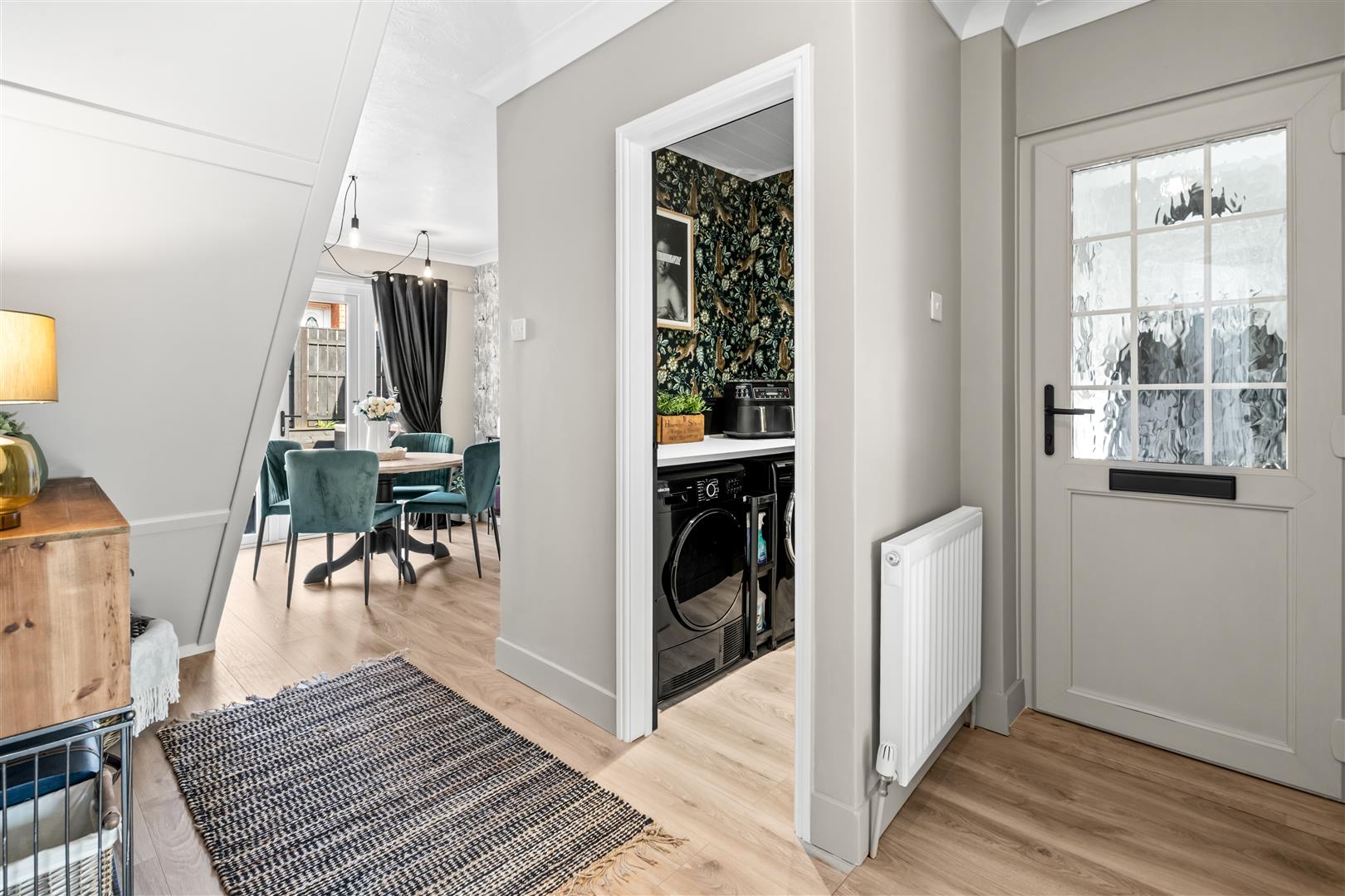 Hallway With View Of Utility & Dining Area